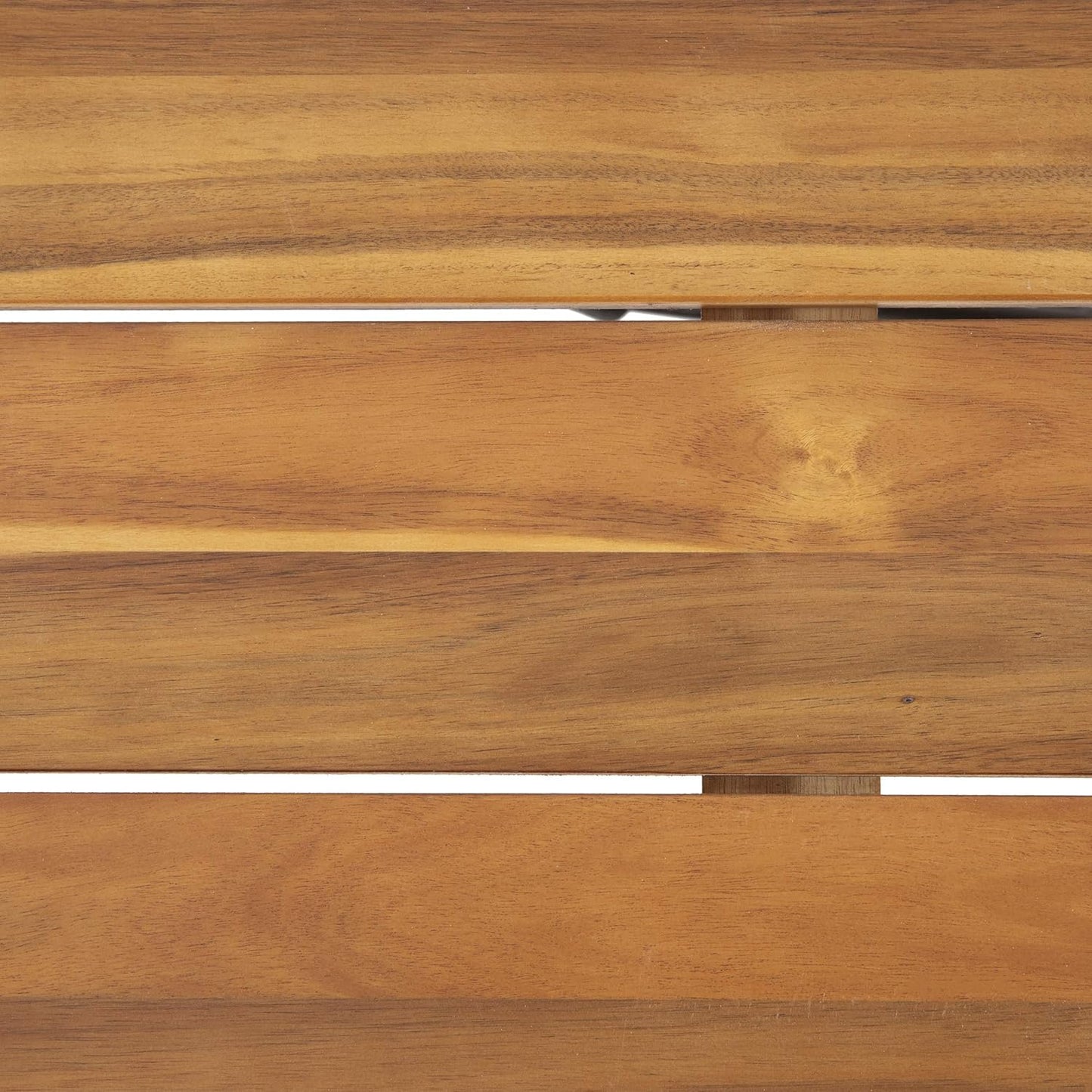 Closeup of natural acacia wood grain on a slatted surface for outdoor furniture