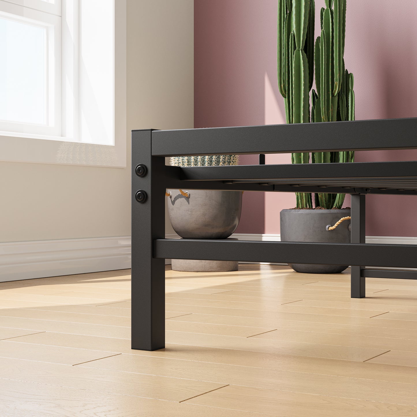 Black metal platform bed frame with wood plank floor