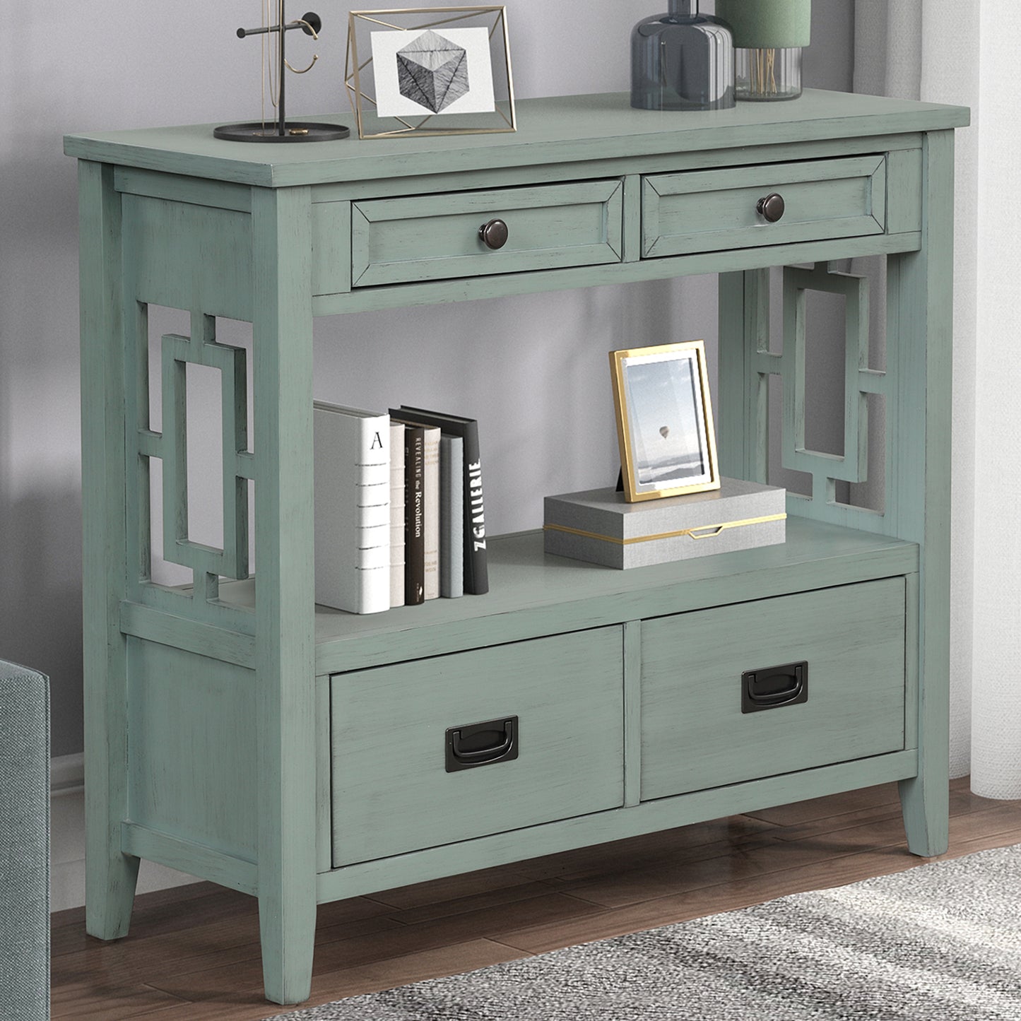 Distressed teal console table with geometric side cutouts and four drawers for entryways