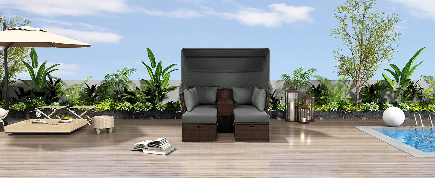 Dark grey upholstered outdoor daybed with builtin storage and canopy