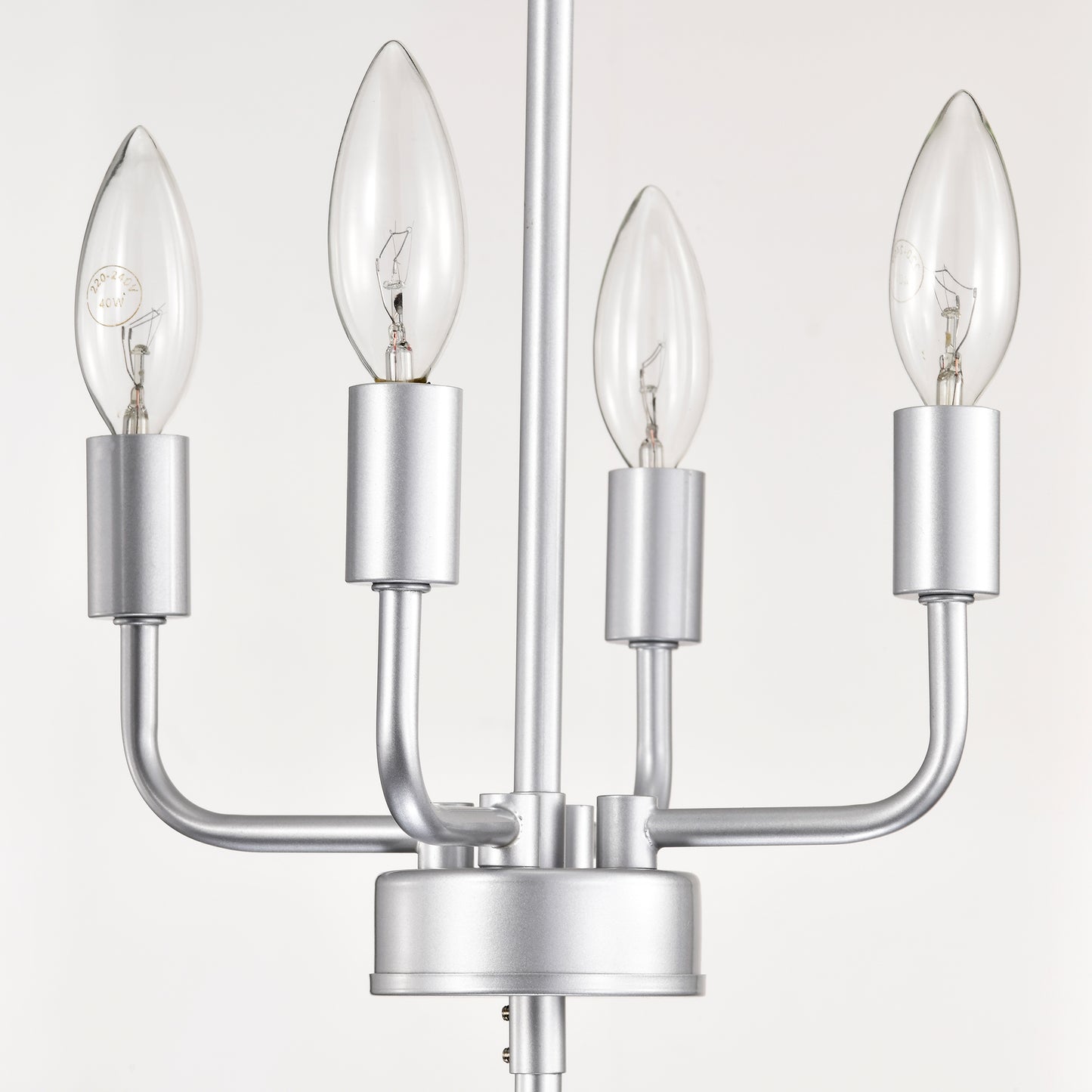 Silver metal chandelier with four clear candleshaped bulbs
