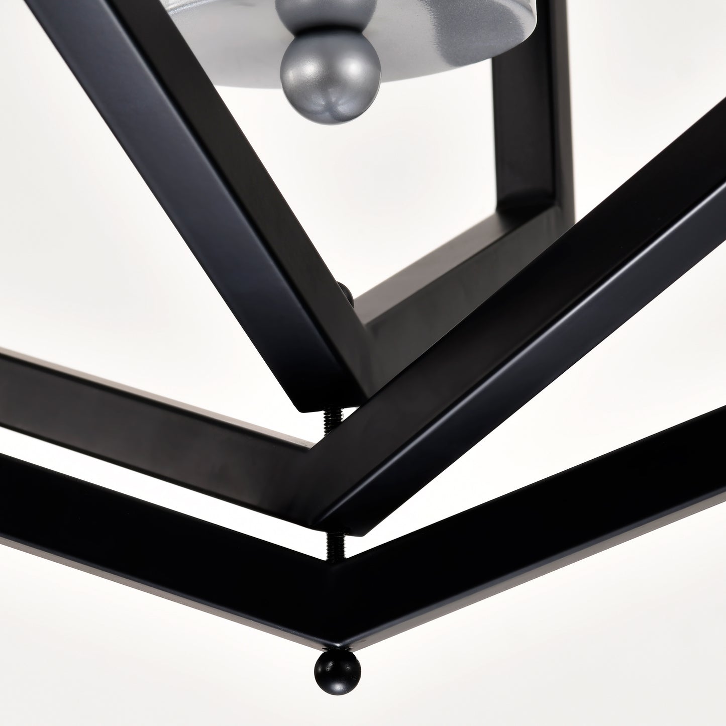 Modern black metal geometric pendant light fixture with silver bulb detail