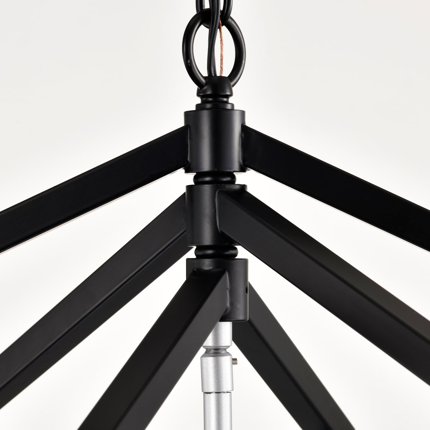 Black geometric chandelier frame with metal accents and suspension chain