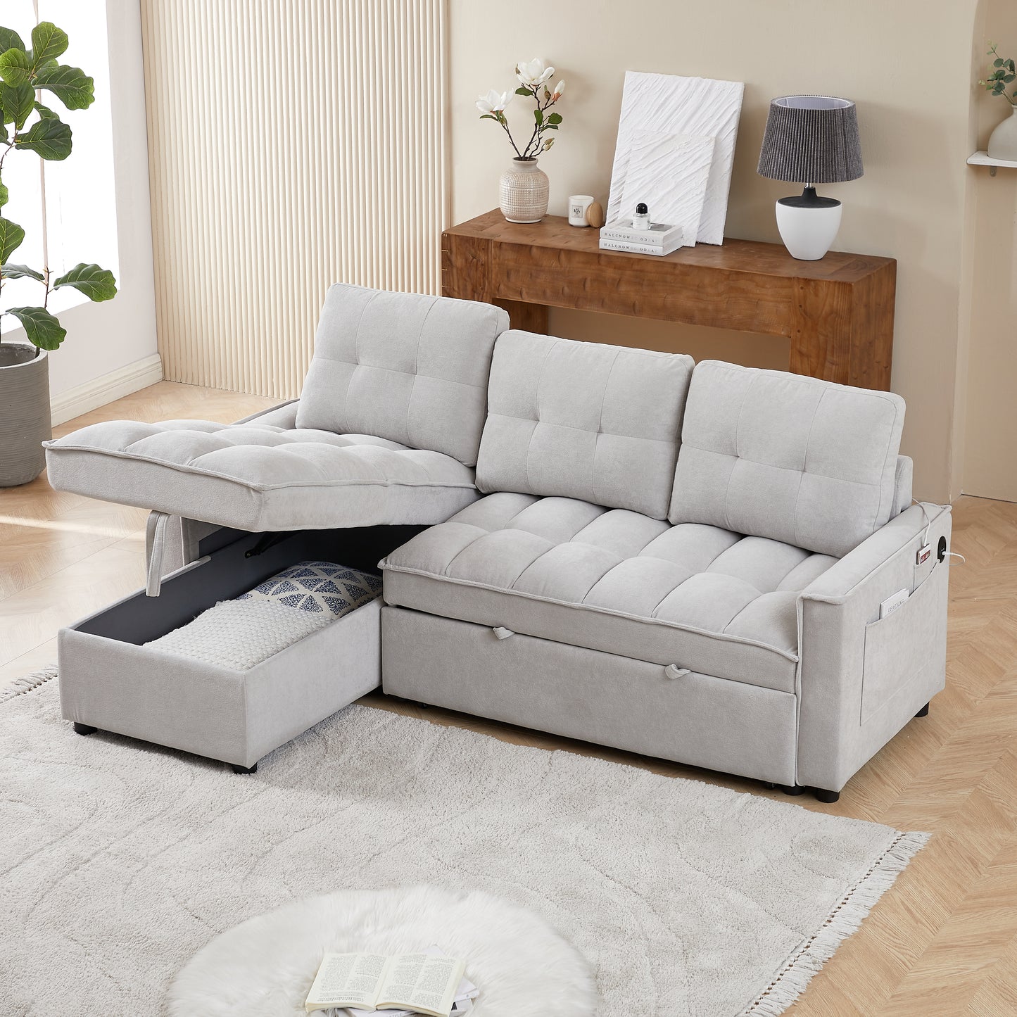 Light gray sectional sofa with tufted cushions and hidden storage compartment shown in a modern living room