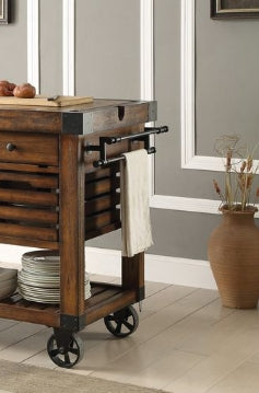 Rustic wooden kitchen island cart with towel rack and stacked plates