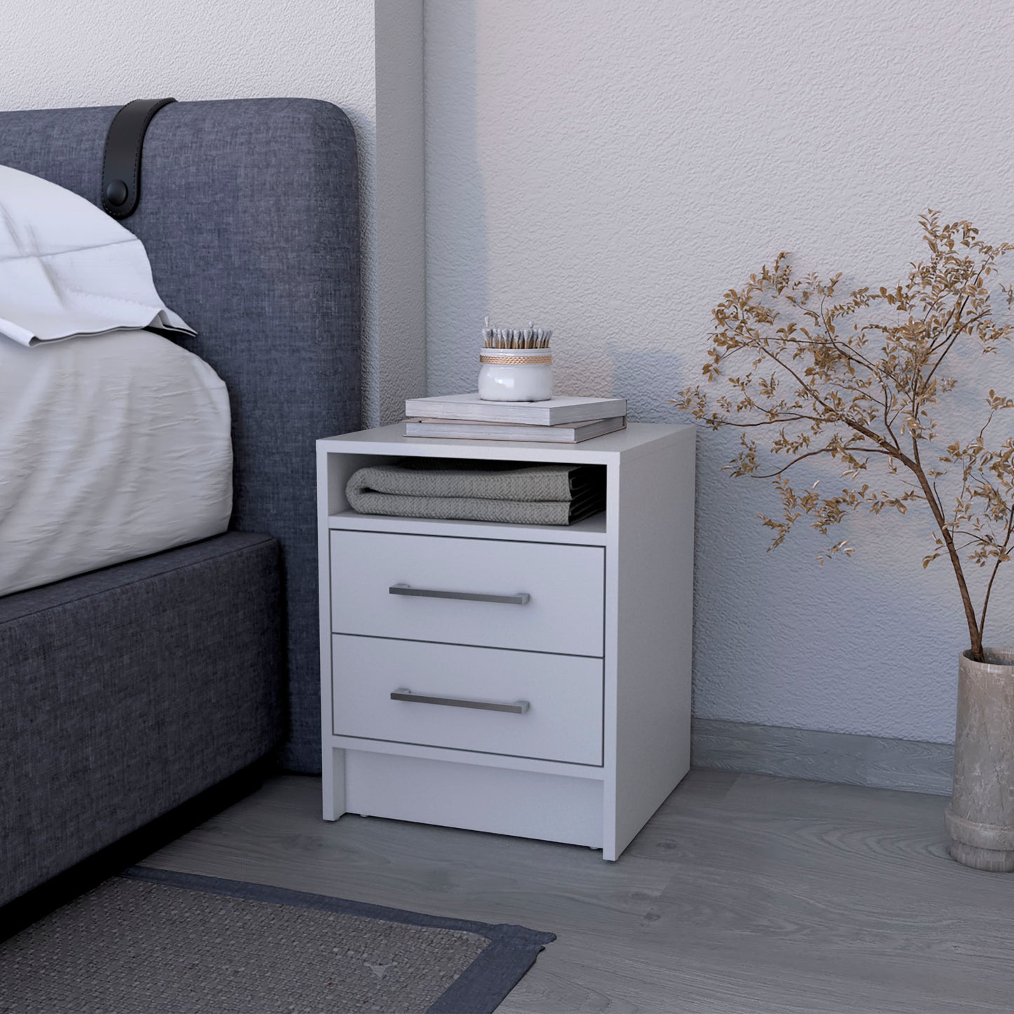 White modern nightstand with two drawers and open shelf beside bed