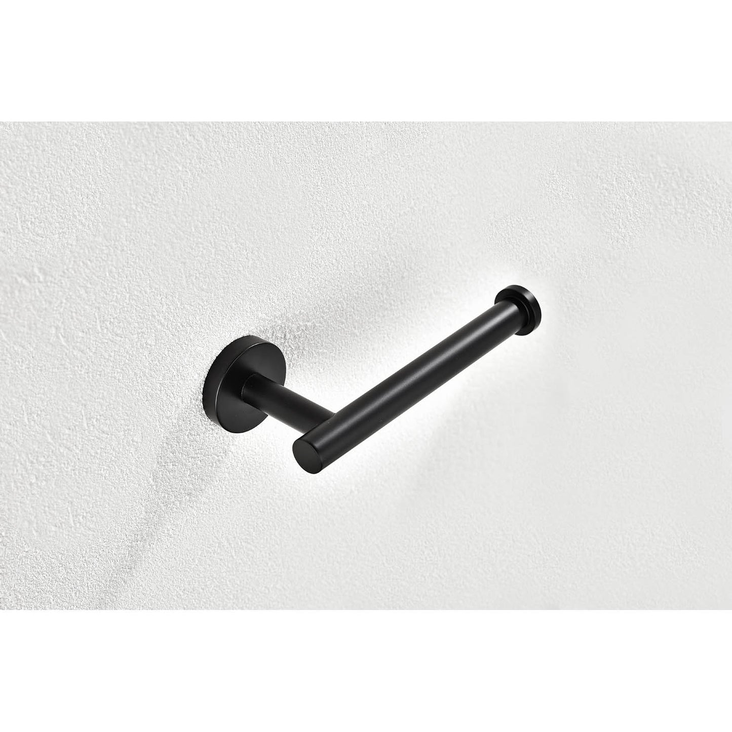 Modern black metal toilet paper holder mounted on a textured white wall