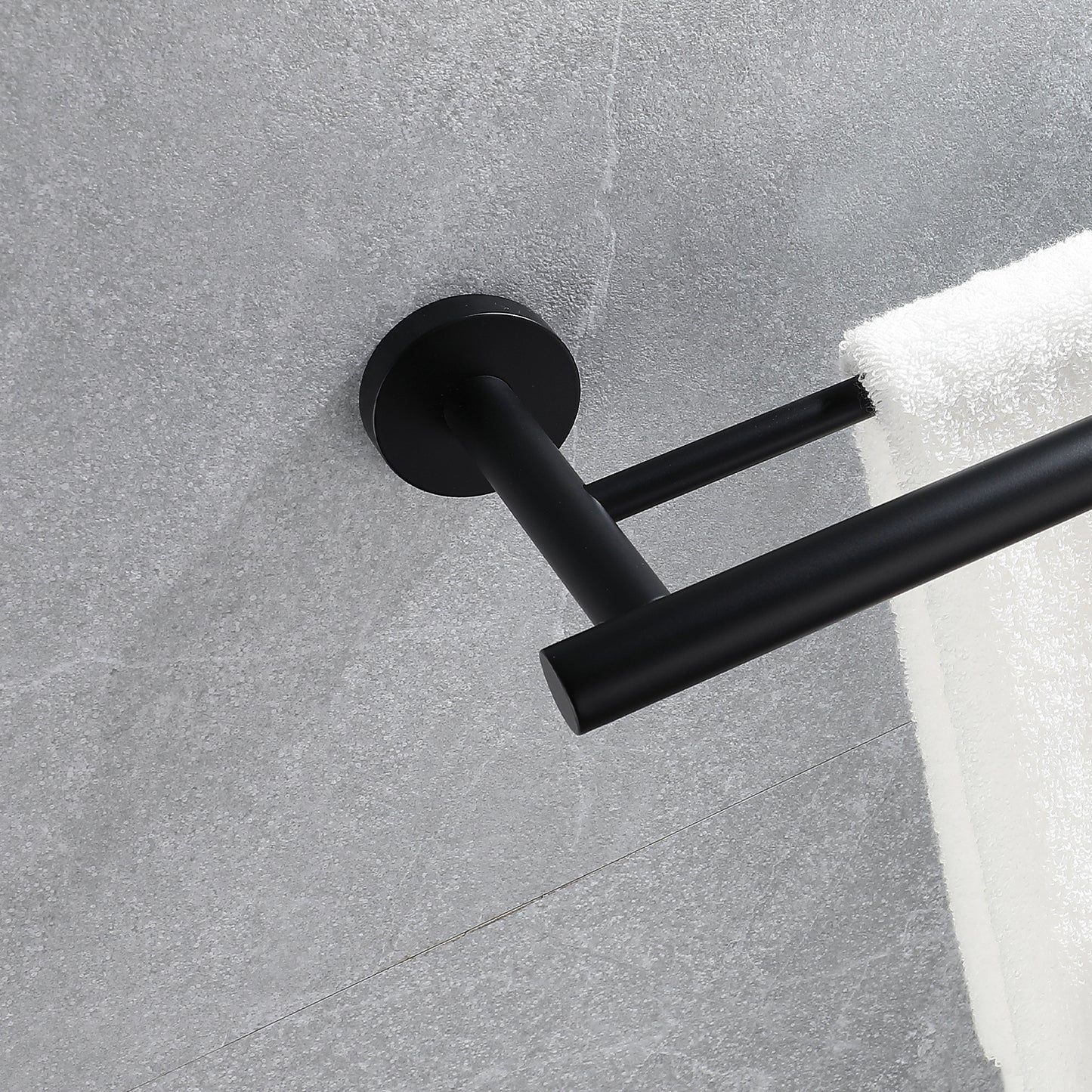 Modern black double towel bar mounted on a gray tiled wall