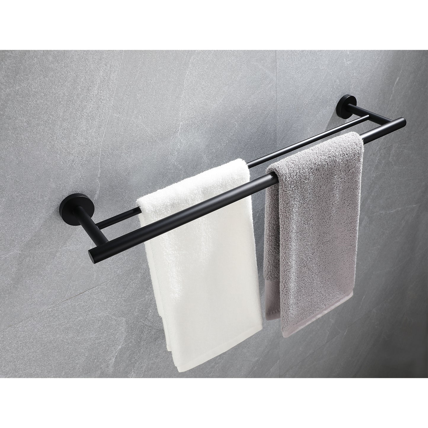 Black double towel bar with white and grey bath towels mounted on a gray tiled wall