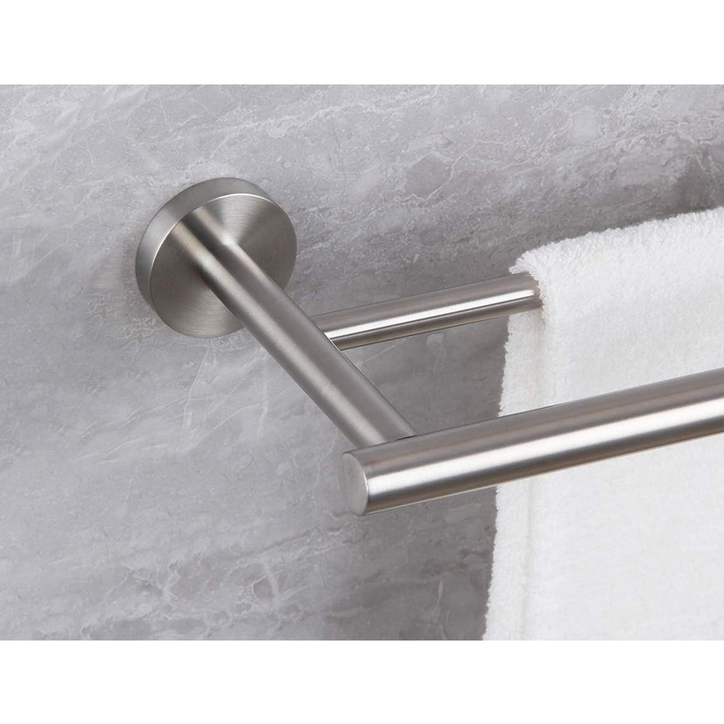 Brushed nickel double towel bar with modern design mounted on marble wall