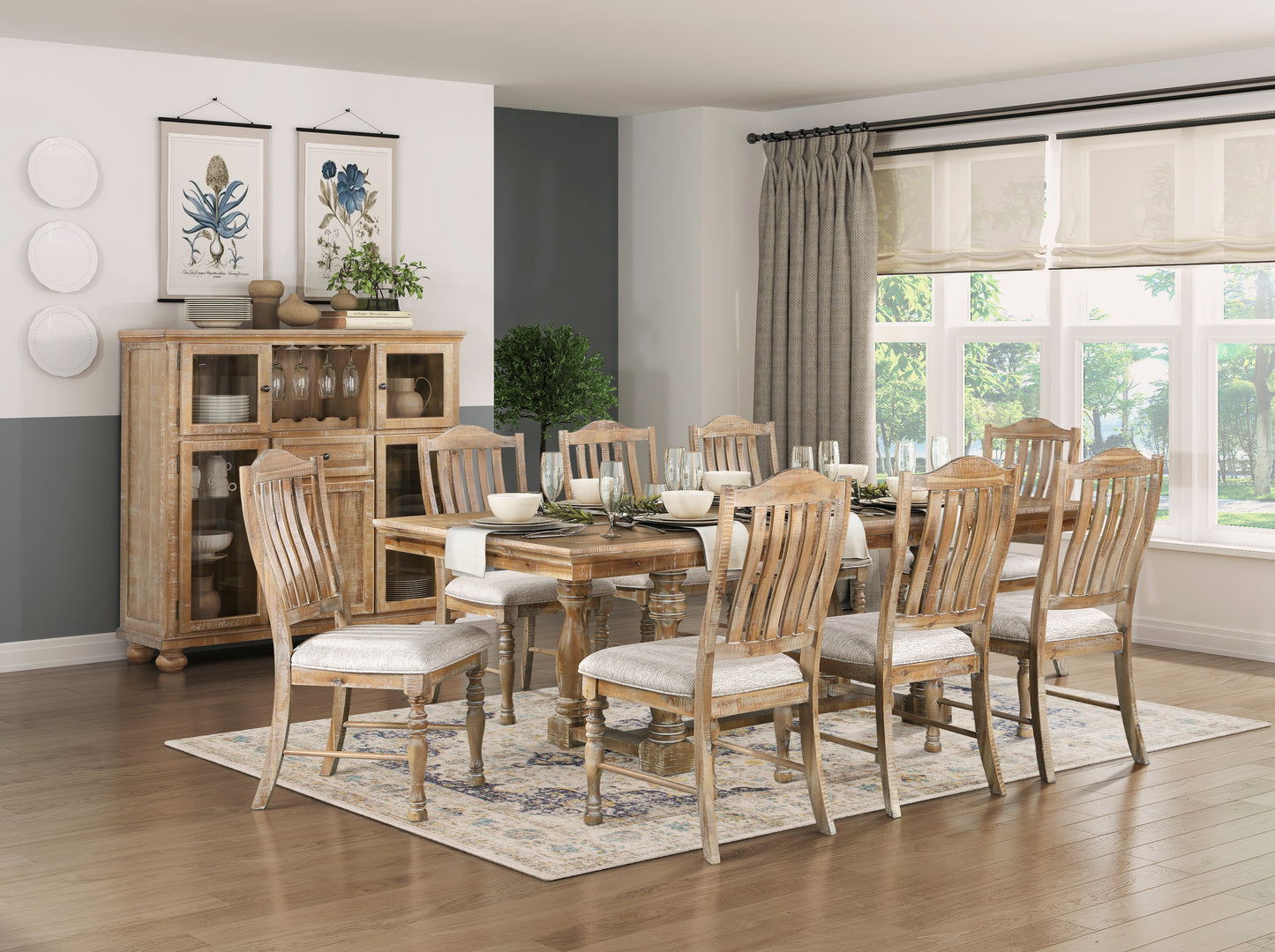 Distressed wood dining table with seating for eight featuring light gray upholstered chairs and neutral rug