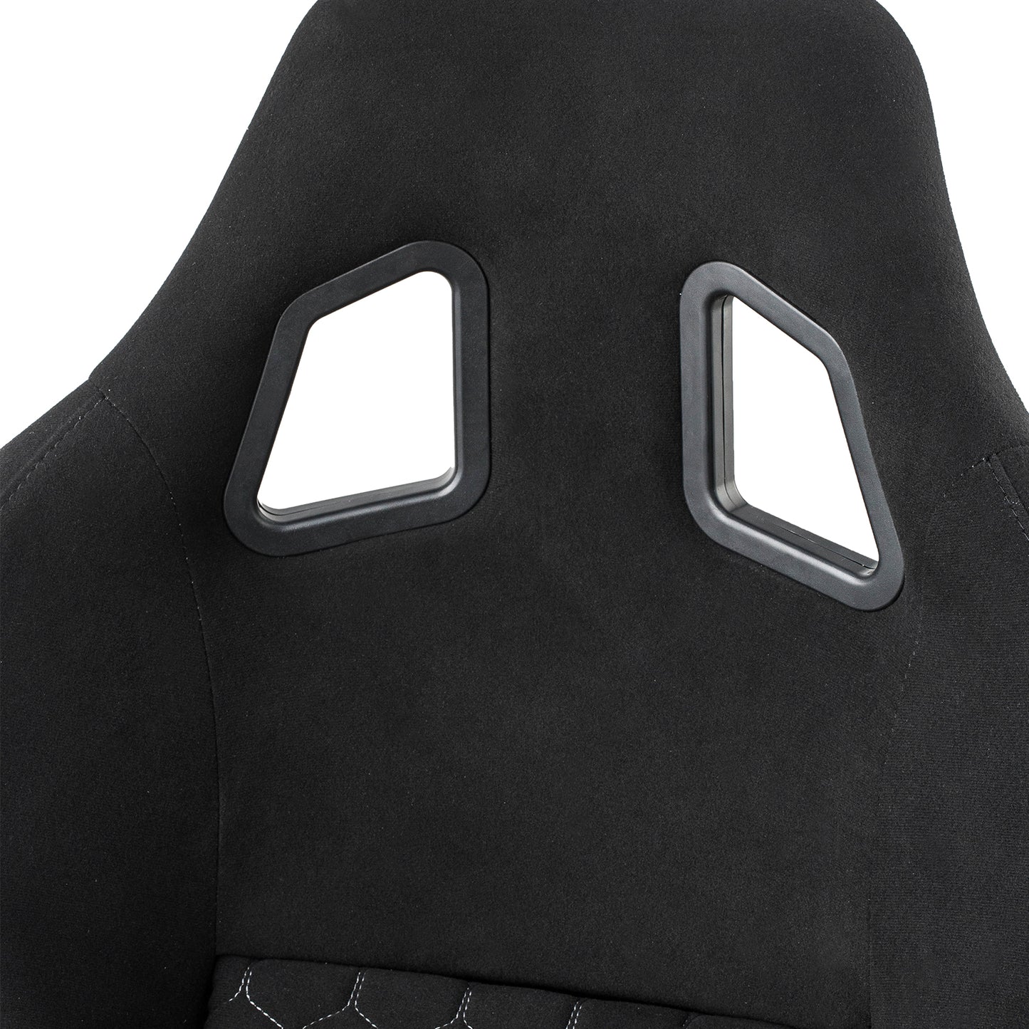 Black racing gaming chair headrest with distinctive cutouts and white stitching detail
