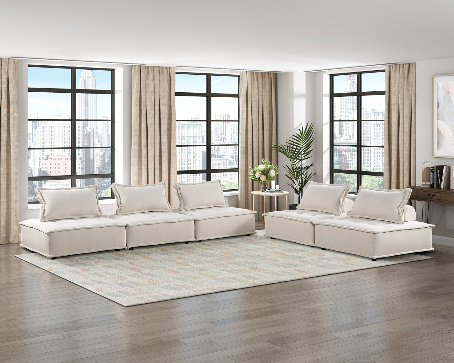 Cream sectional sofa with plush cushions on a geometric rug perfect for modern living rooms