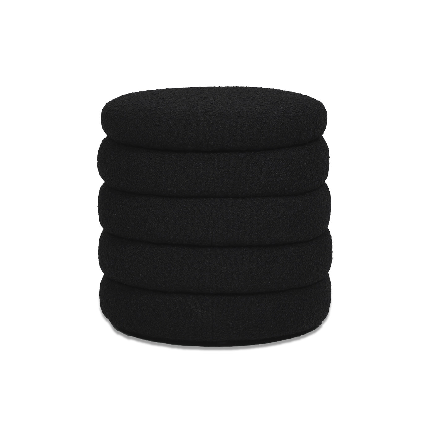Stack of five black cushioned headphone ear pads made from textured fabric