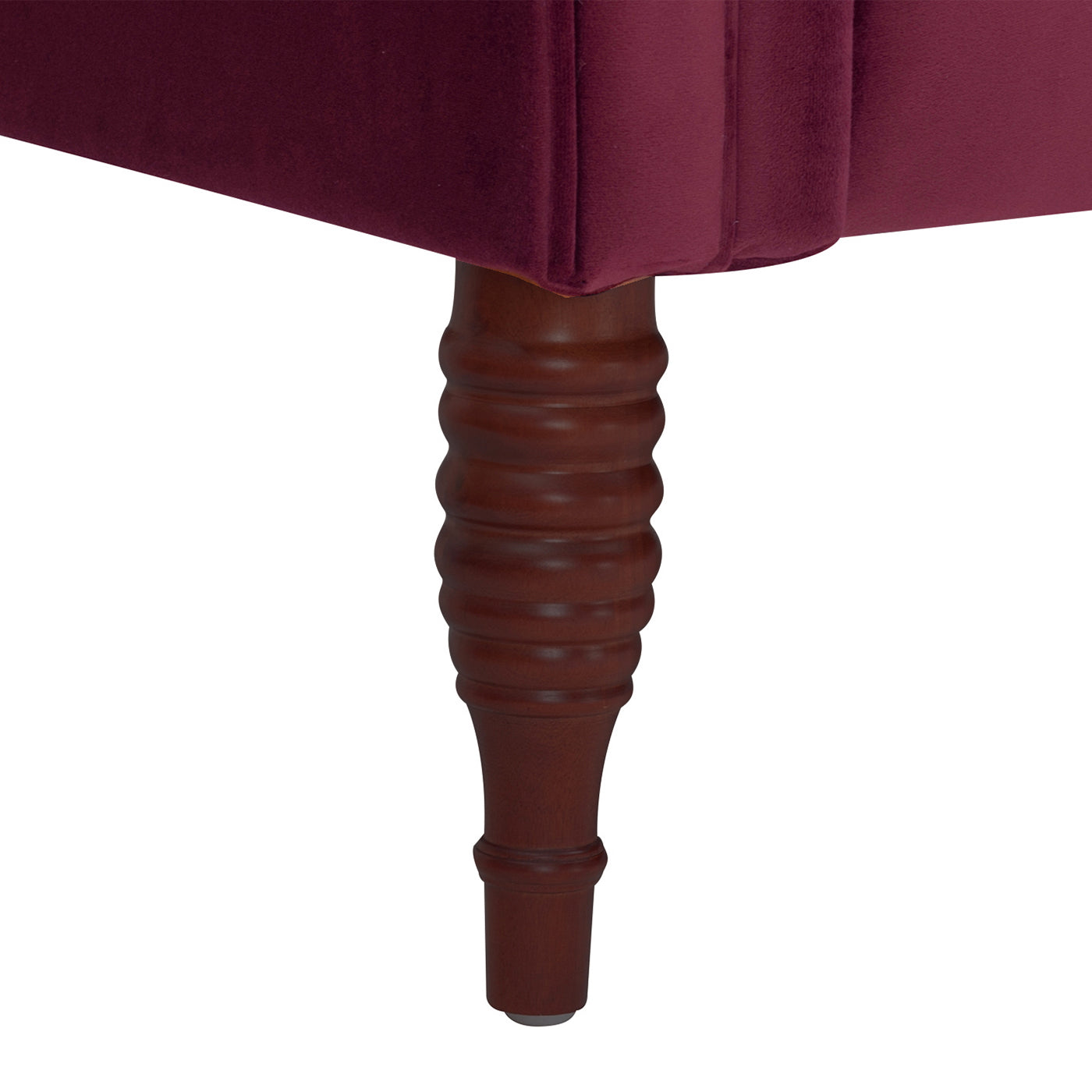 Maroon velvet upholstered tufted ottoman with carved wooden leg