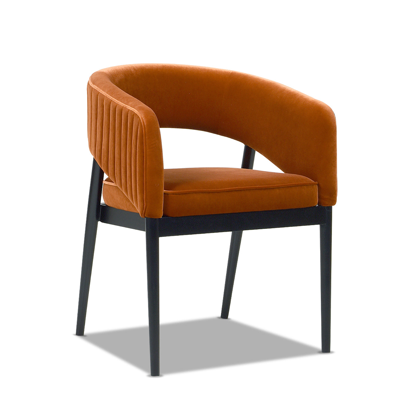 Orange velvet accent chair with fluted detailing and black frame