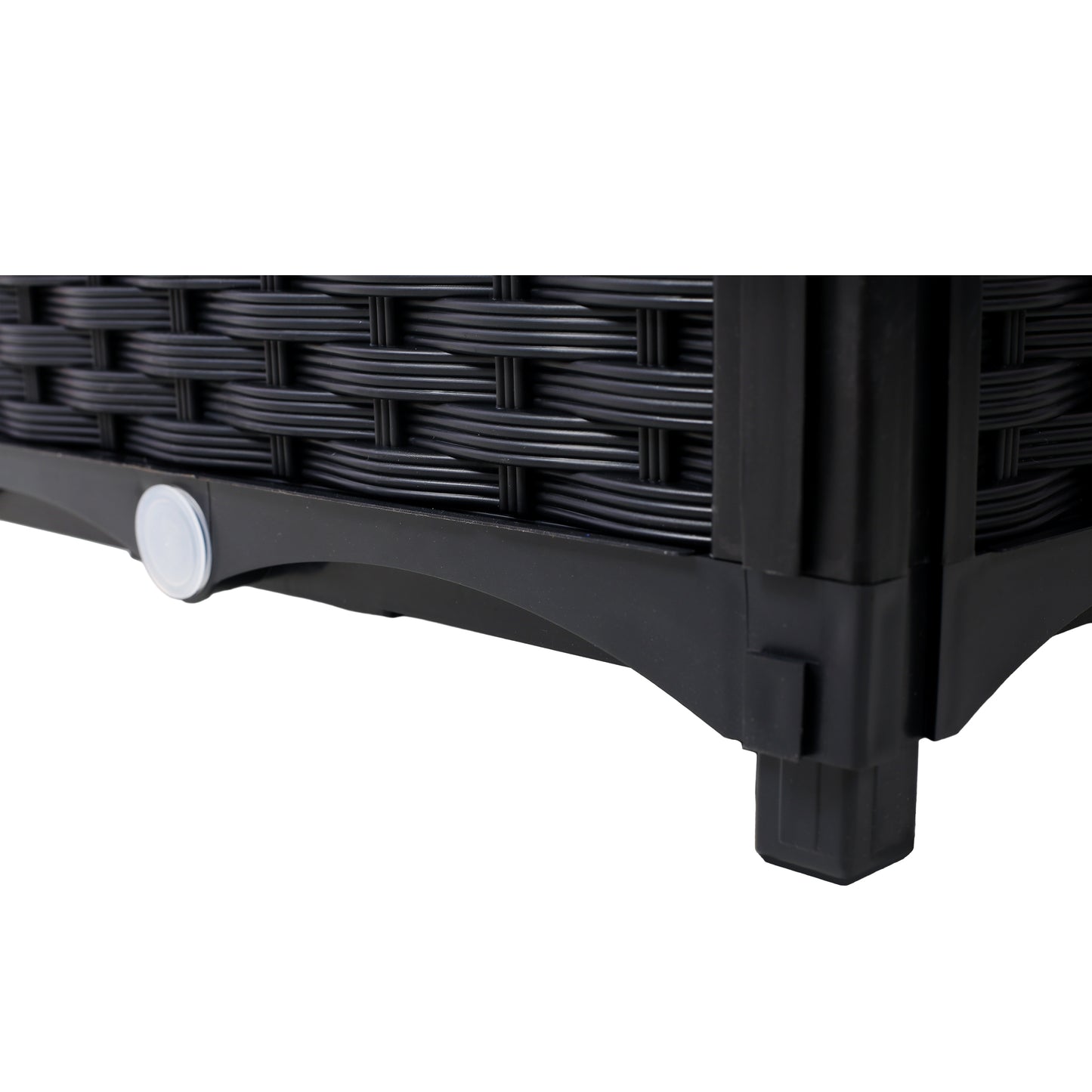 Black wicker storage box detail showing woven texture and sturdy legs