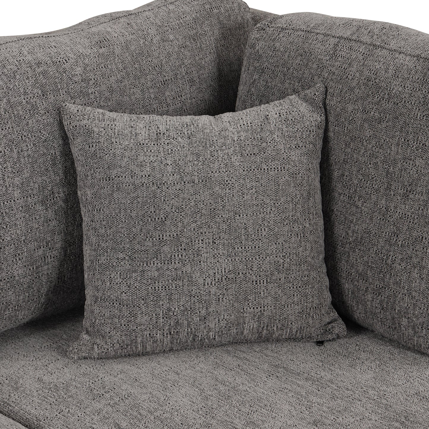 Closeup of a plush charcoal grey sofa with textured fabric and accent pillows