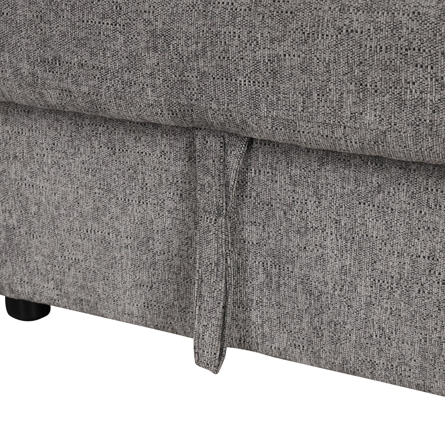 Closeup of grey textured sofa fabric with a pull tab for storage Perfect for small apartment dwellers