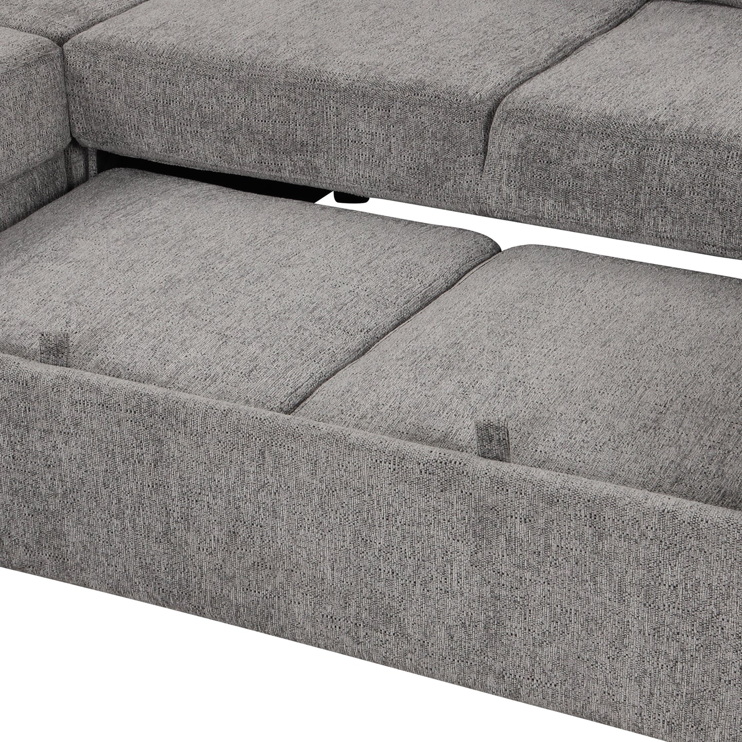 Close up of grey fabric on a sectional sofa with pullout bed mechanism