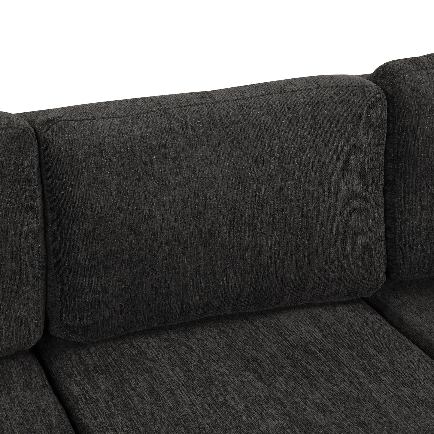 Closeup of a textured dark grey sofa cushion with a plush feel