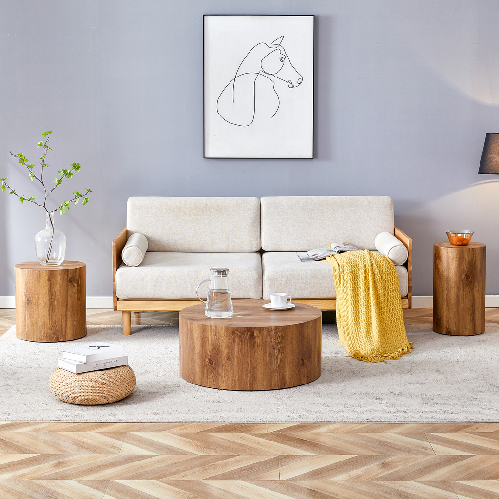 Modern living room with a cream sofa and a round wooden coffee table