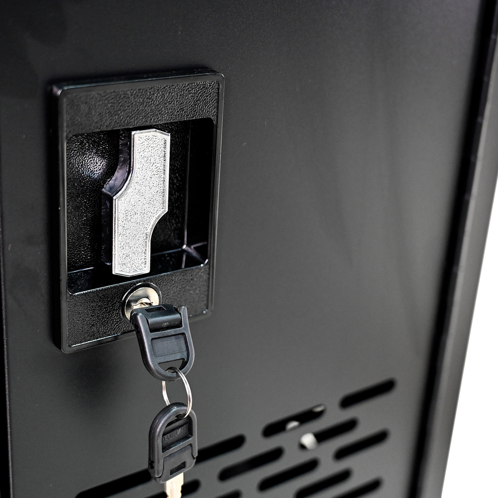 Closeup of a silver metal latch and two black keys on a black metal cabinet door