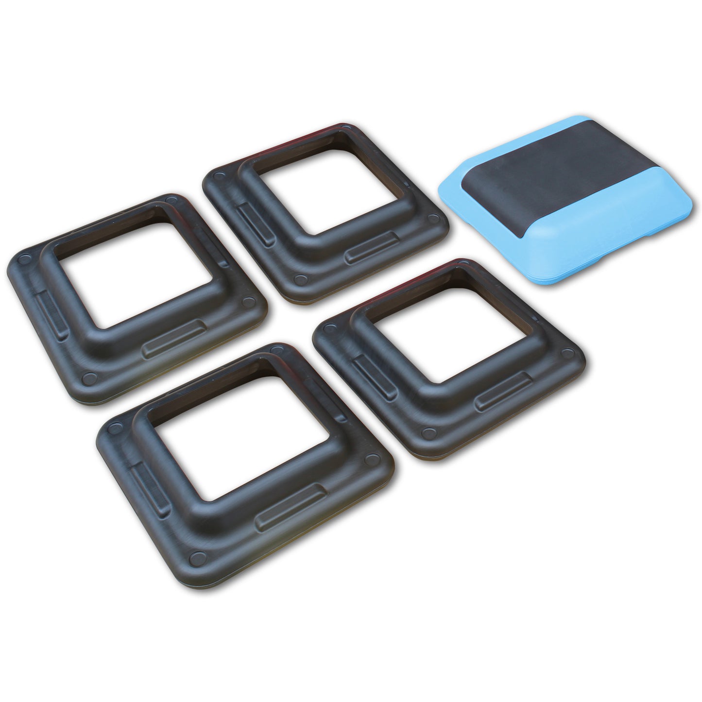 Four black aerobic stepper risers and one blue and black exercise step platform