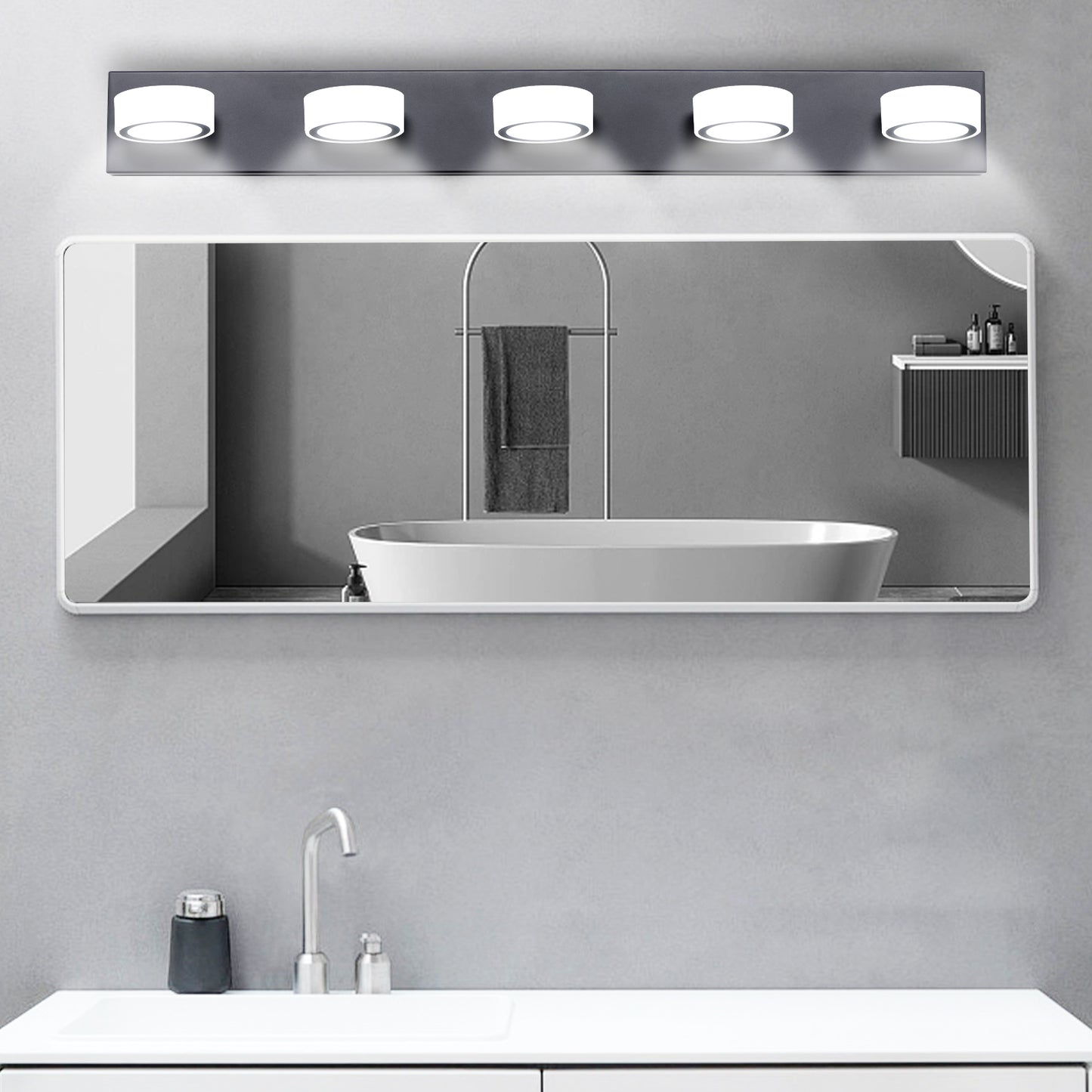 Modern vanity light fixture with five circular LED lights in a brushed nickel finish