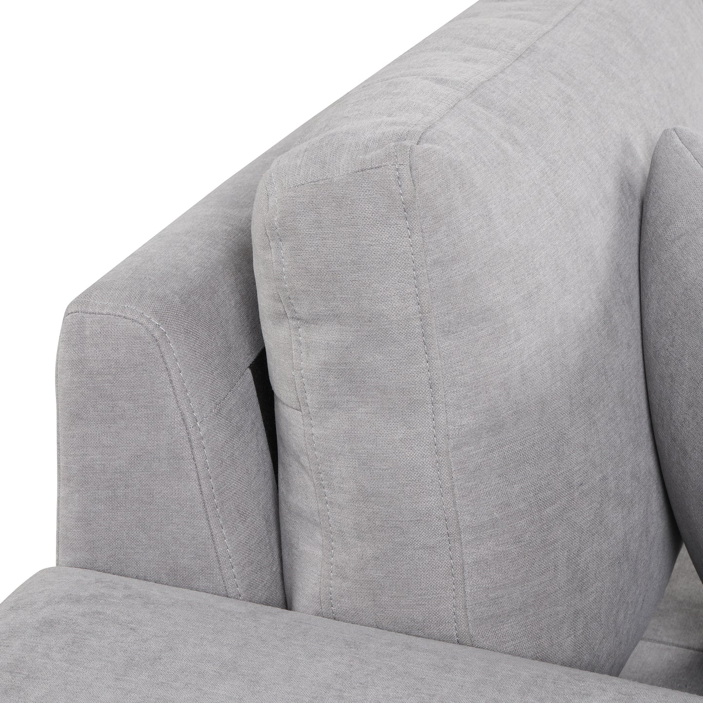Closeup of textured grey fabric sofa armrest with stitched detailing