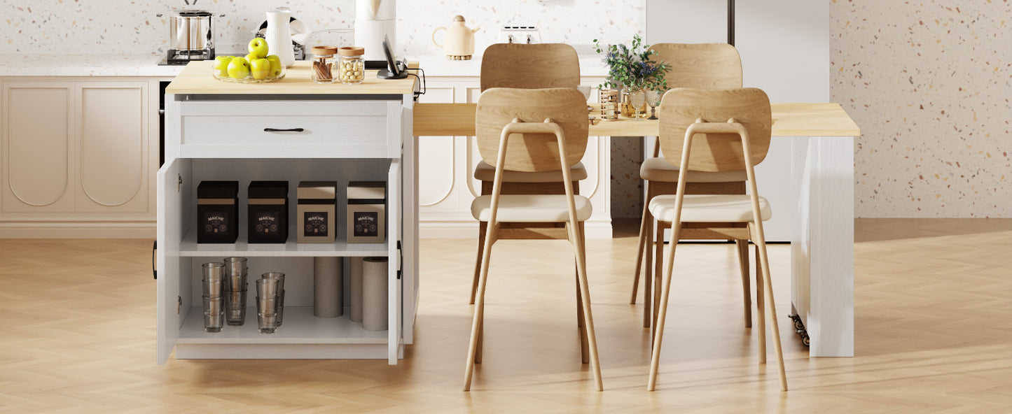 White kitchen island with open storage featuring canisters and glassware