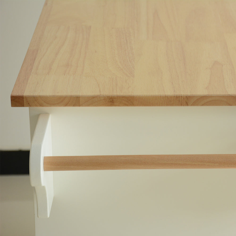 White kitchen cart with light wood butcher block top and towel bar