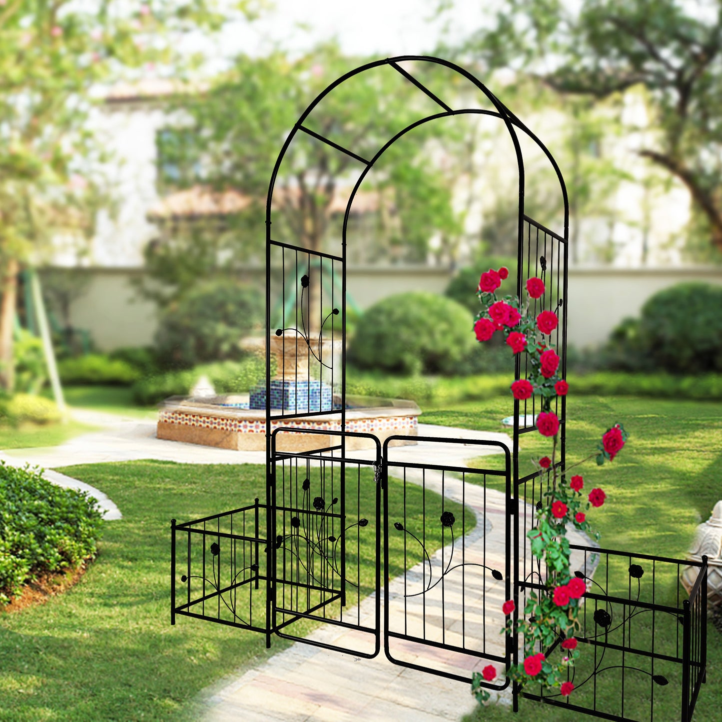 Black metal garden arch with ornate scrollwork and rose vine accent