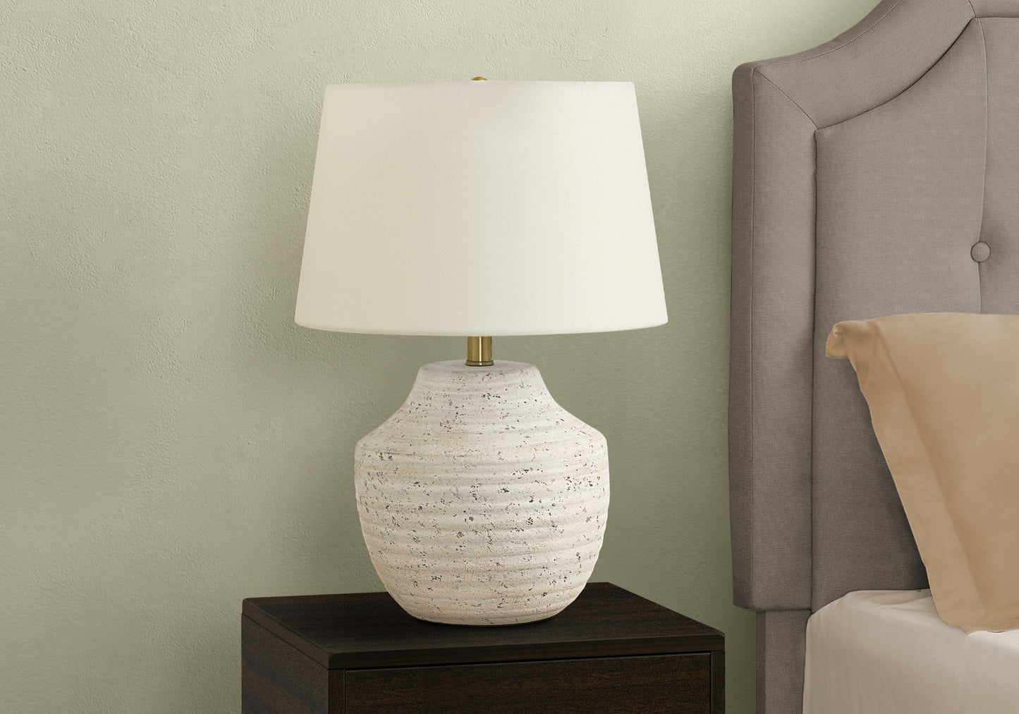 Textured ceramic bedside lamp with white drum shade and brass accent