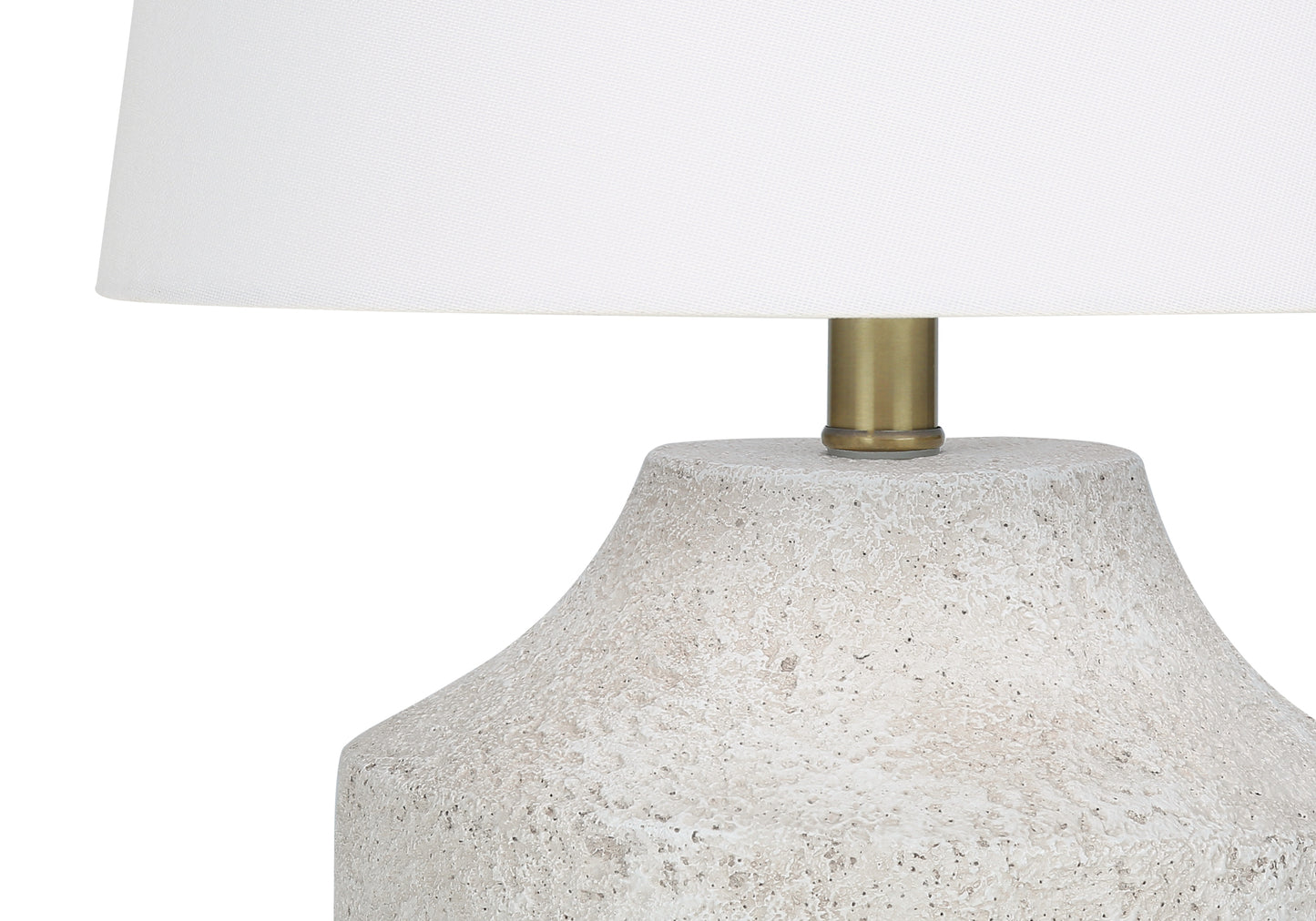 Textured ceramic base table lamp with white linen shade and brass accents