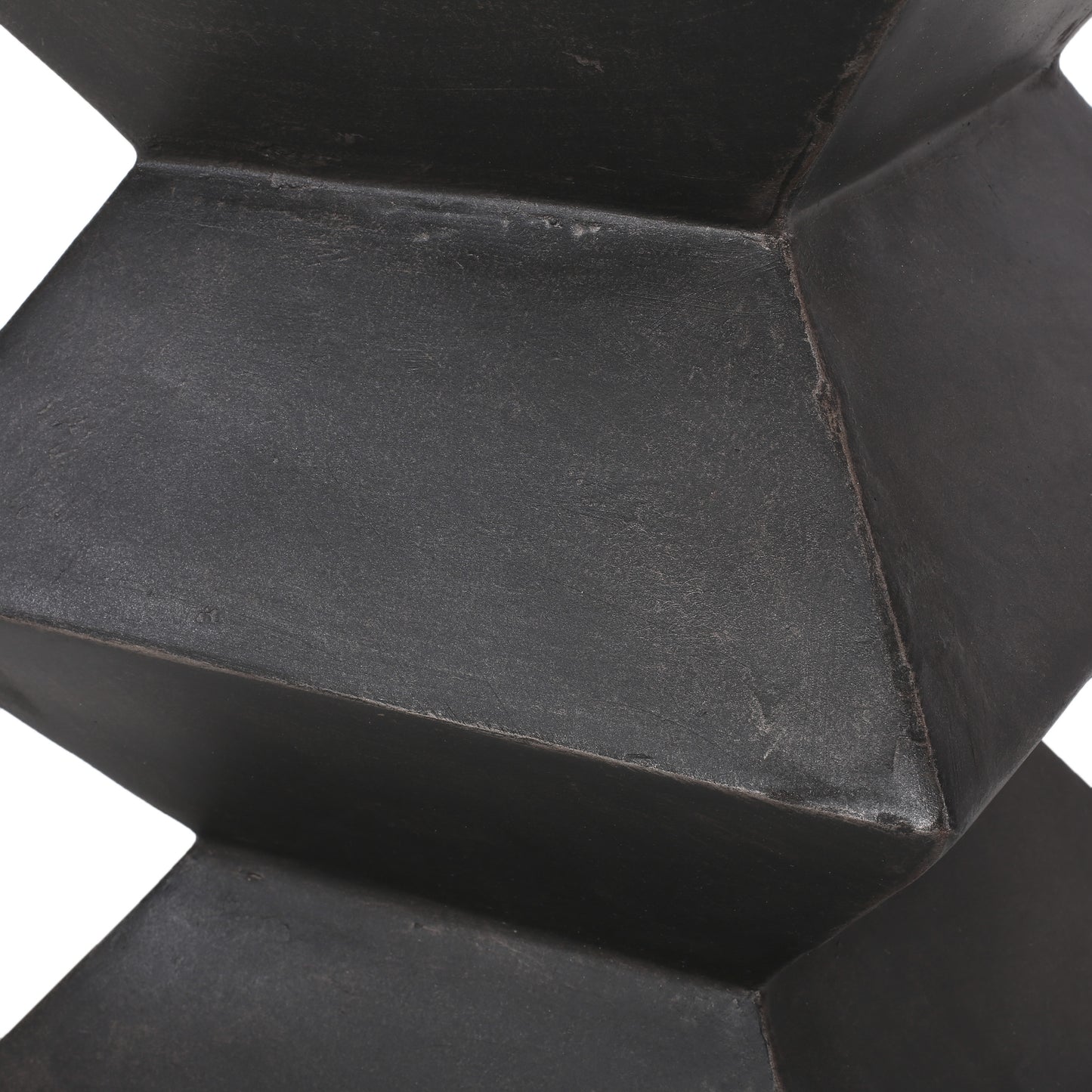 Dark gray textured geometric accent table with angular facets