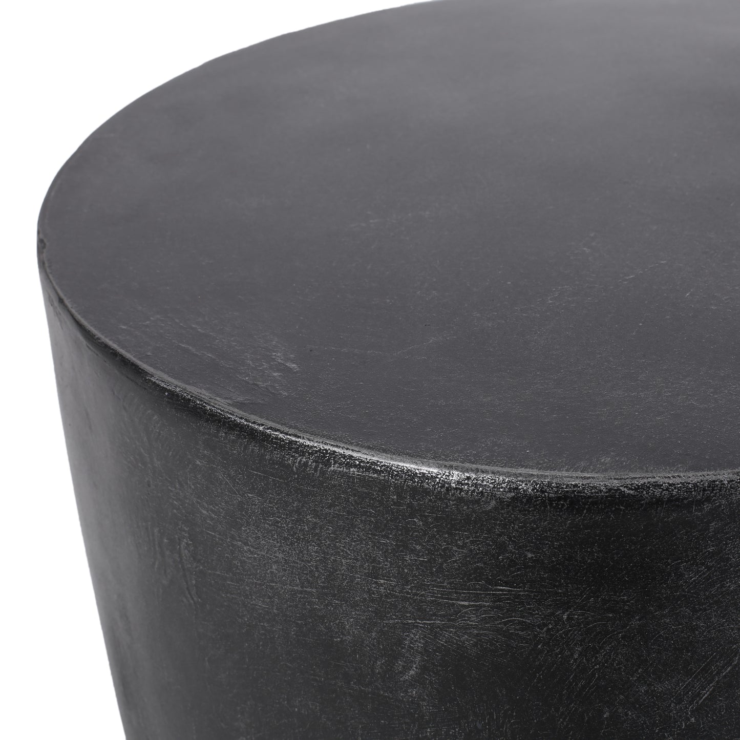 Closeup of a textured dark grey cylindrical stool modern accent furniture