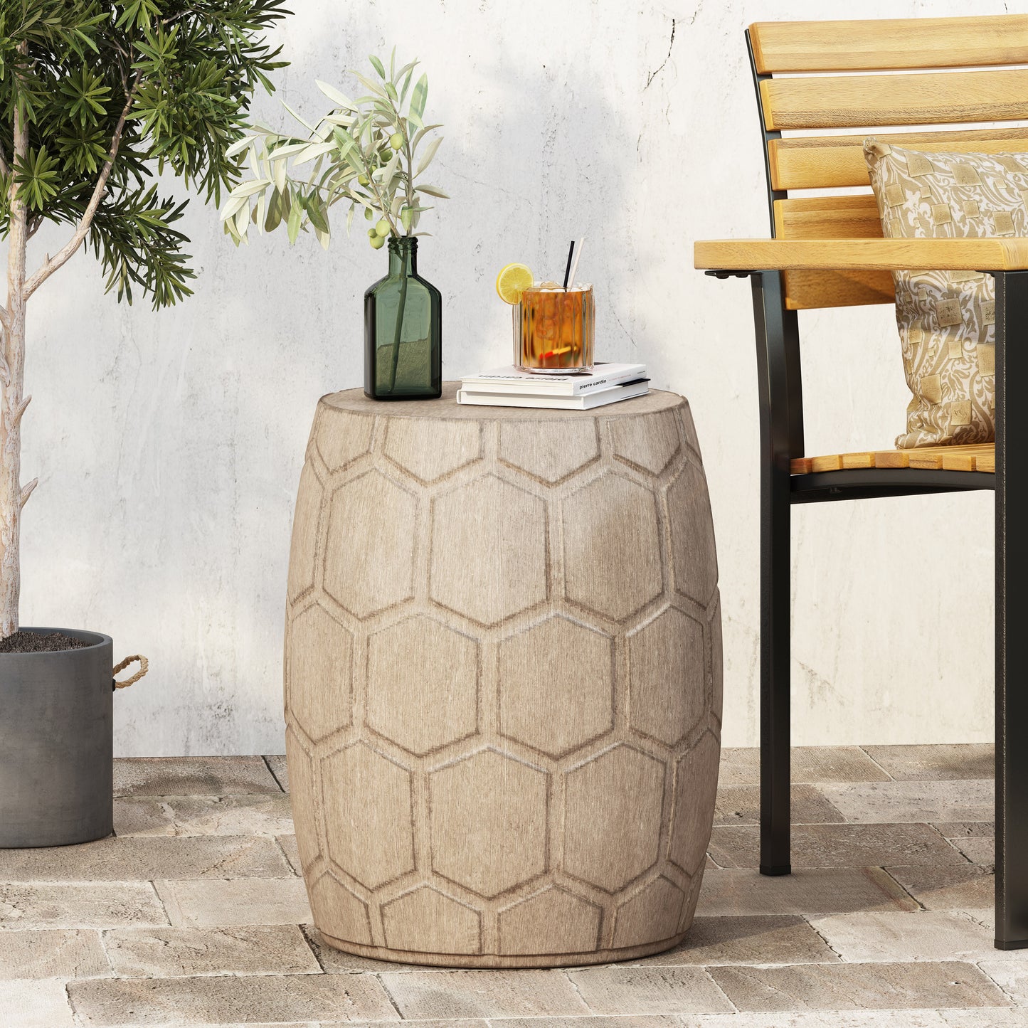 Round faux wood side table with hexagonal pattern perfect for outdoor patios