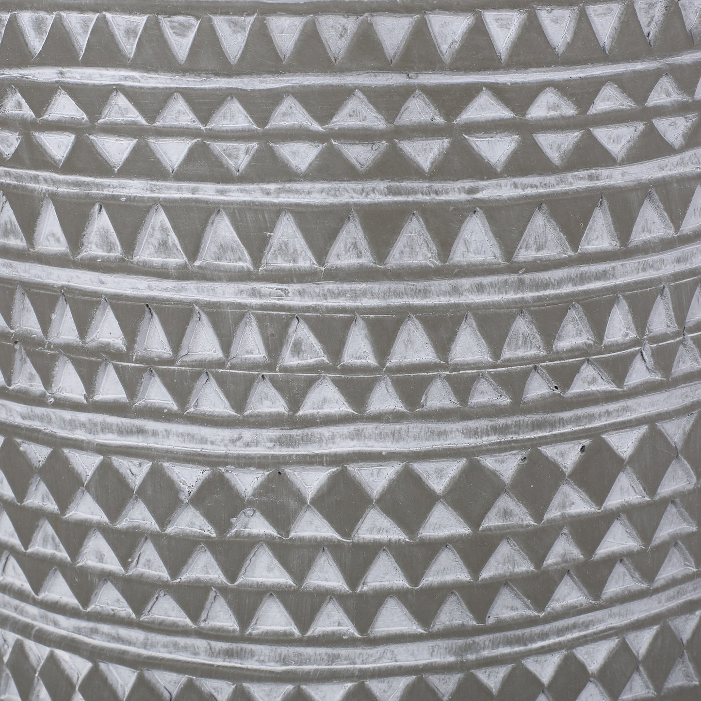 Gray concrete pot with raised triangle pattern