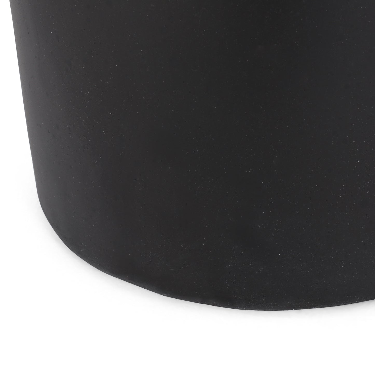 Textured black ceramic planter with smooth finish