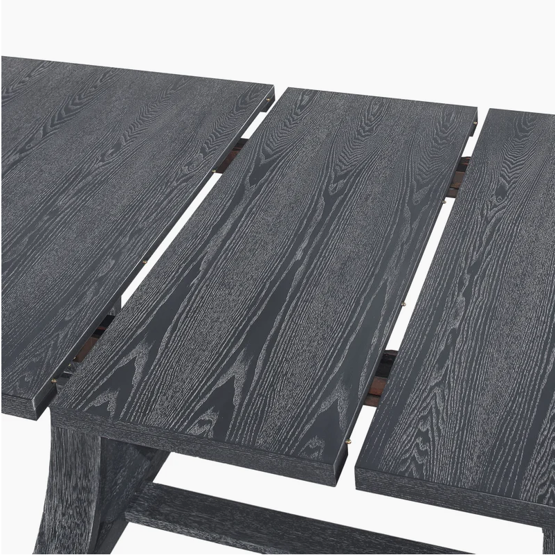 Closeup of a dark gray wooden dining table with visible wood grain texture