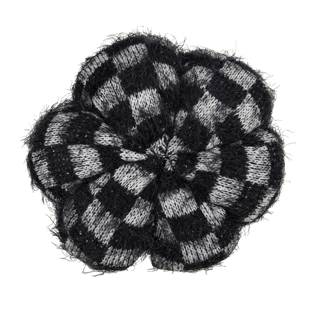 Black and white checkered knit flower brooch with frayed edges for accessory decoration