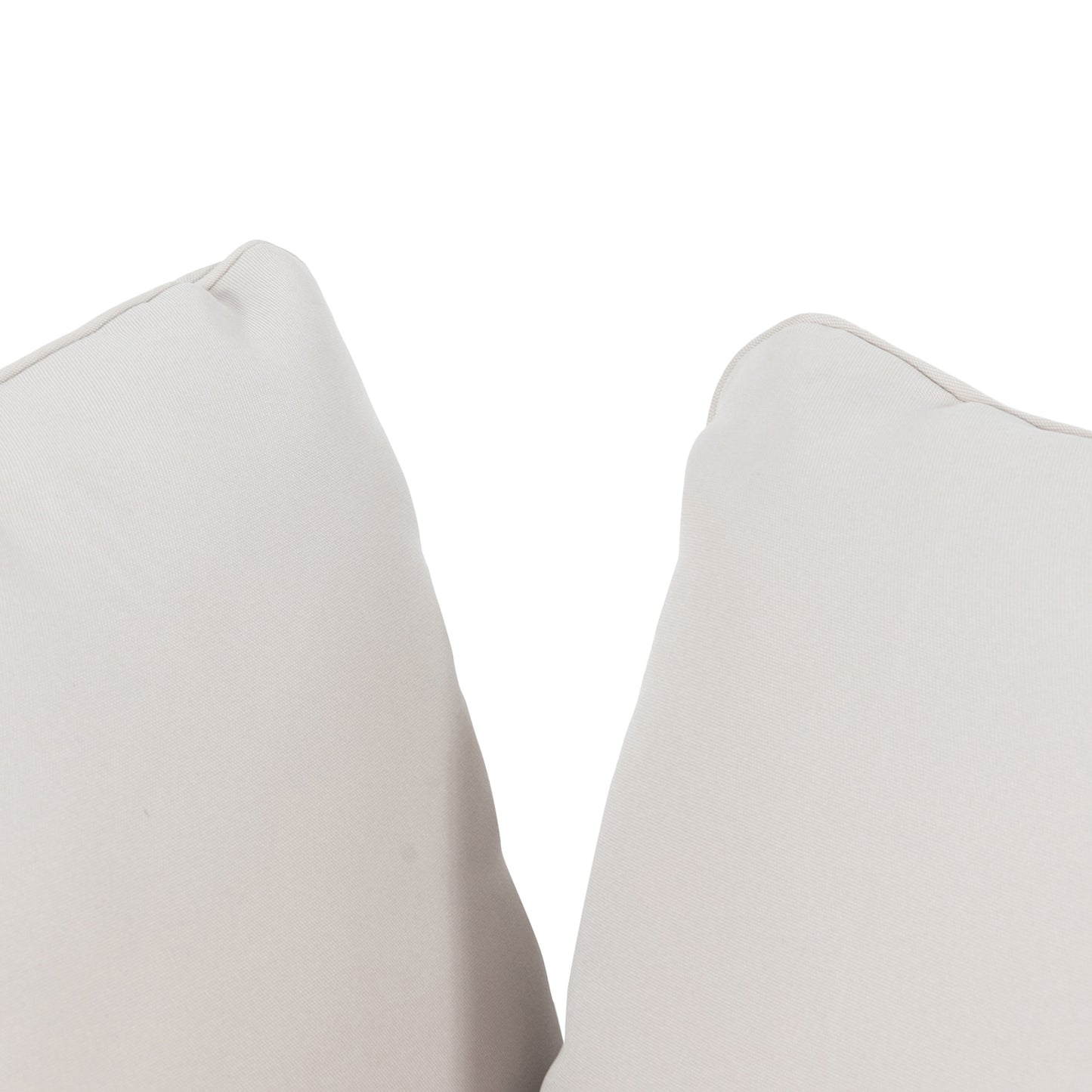 Closeup of two light gray outdoor cushions with stitched piping showcasing durable fabric for patio furniture