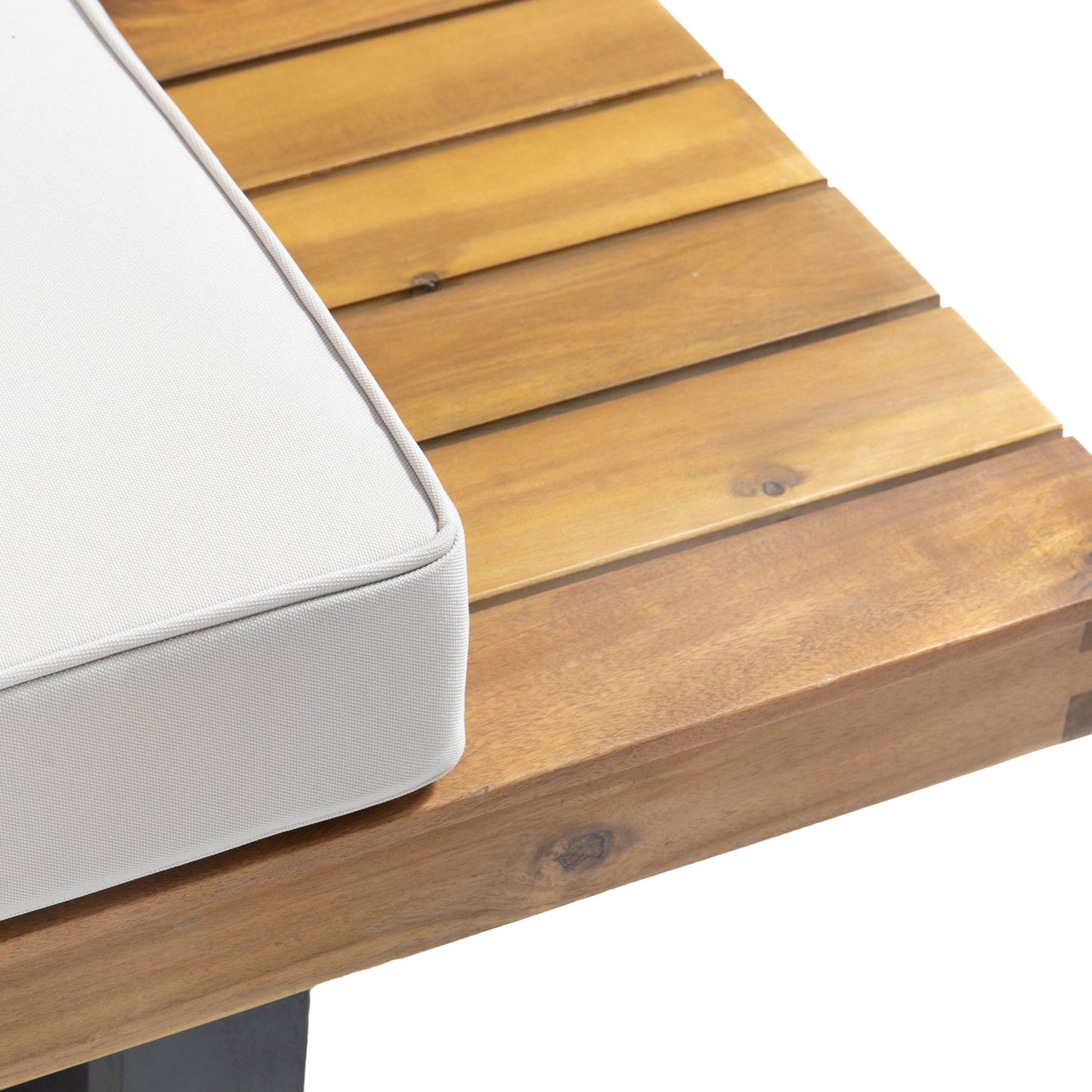 Closeup of a white outdoor cushion on a slatted wooden table perfect for patio furniture