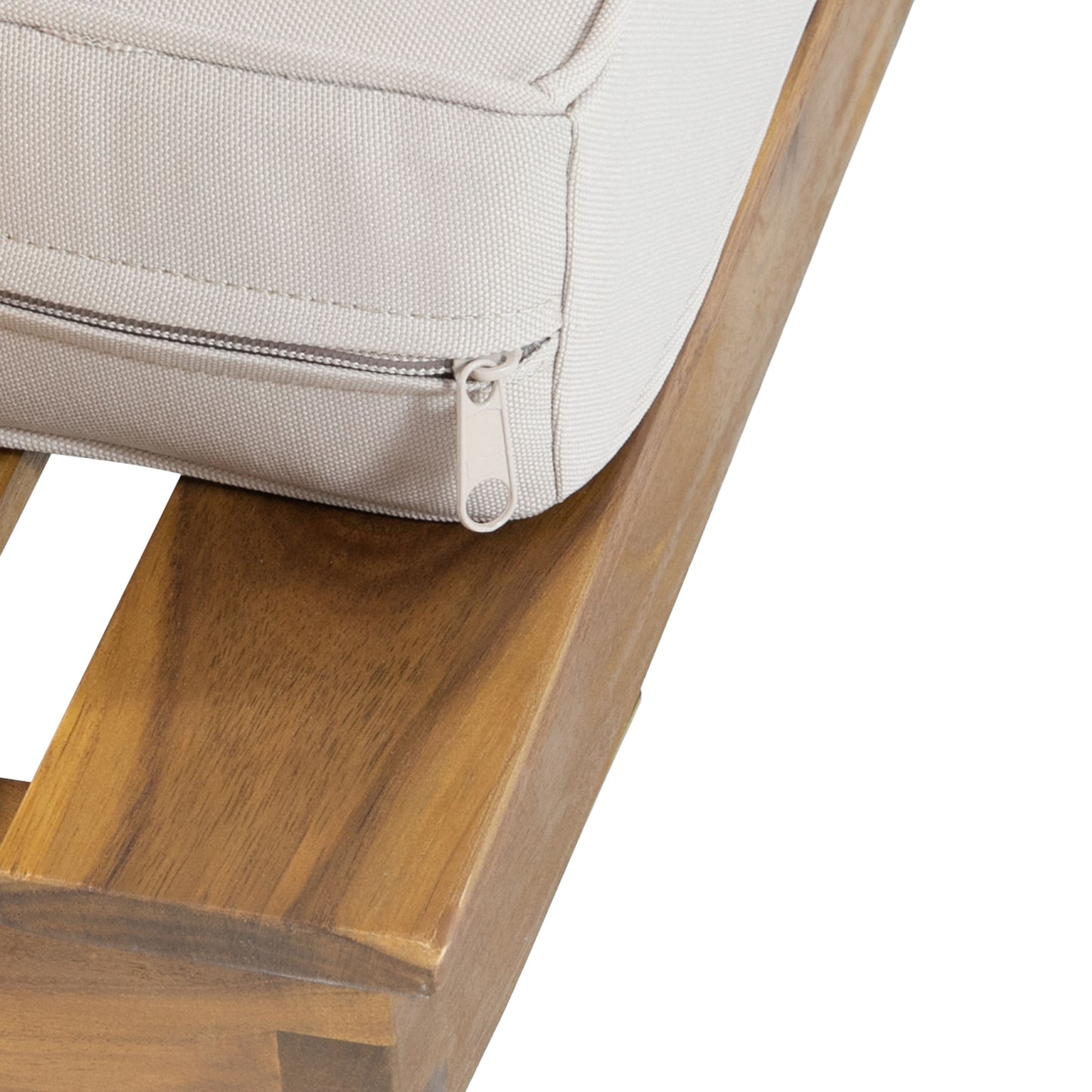 Closeup of a beige outdoor furniture cushion with a light gray zipper on a wooden base