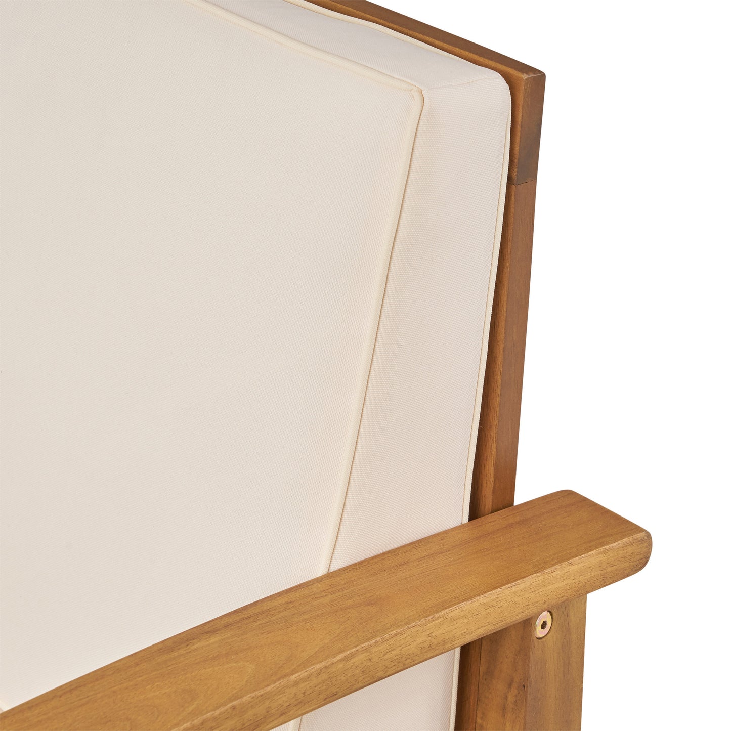 Closeup of creamcolored cushion on a modern acacia wood patio chair