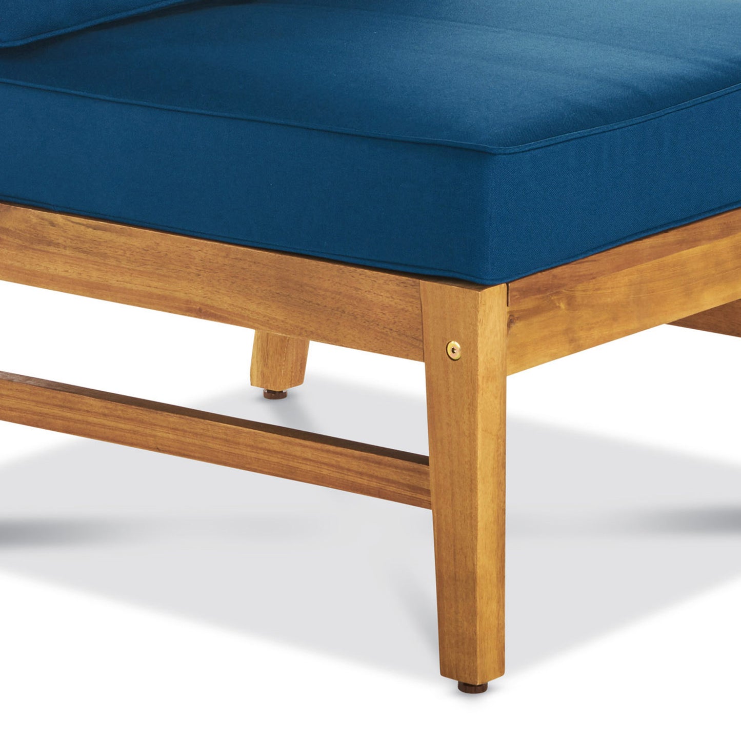 Closeup of a blue upholstered outdoor sofa cushion on a wooden frame