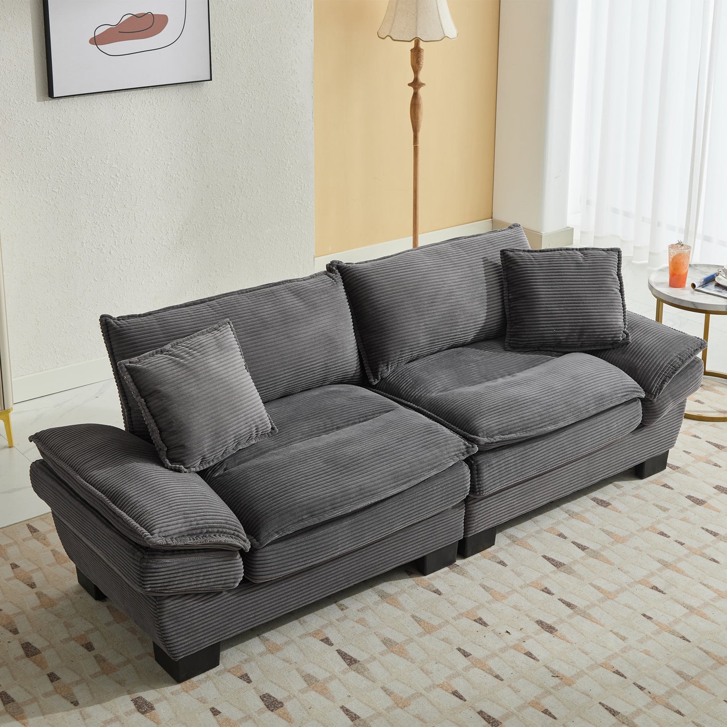Comfortable dark gray corduroy sectional sofa with plush cushions and throw pillows