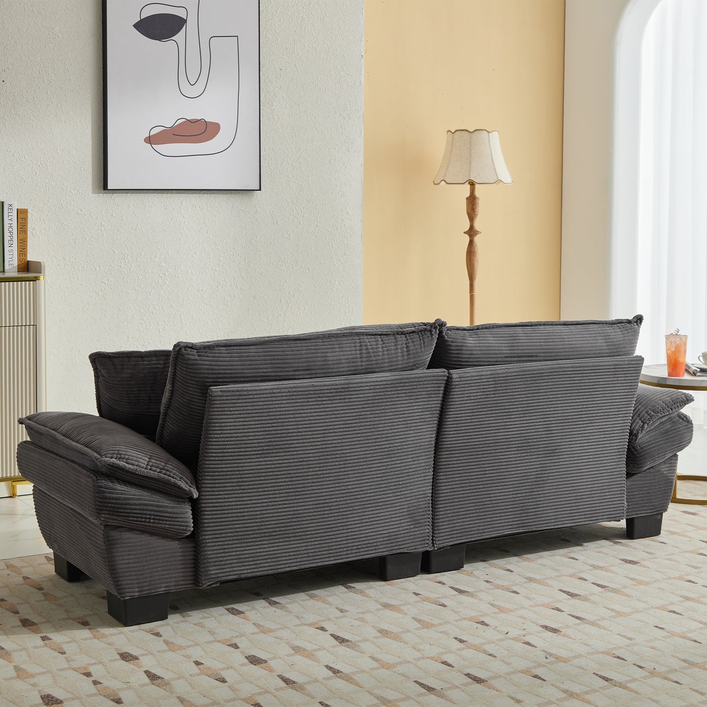 Dark gray corduroy sofa with plush cushions and modern design perfect for living room comfort