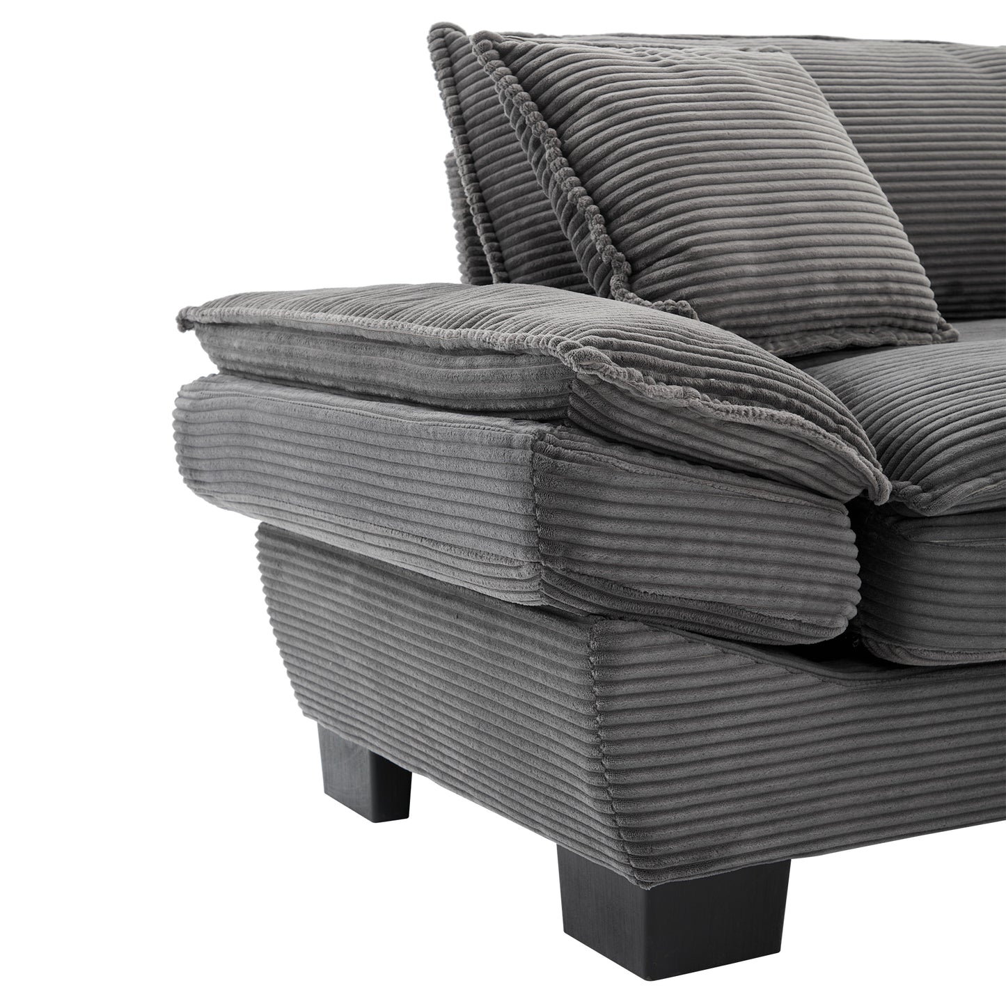Gray corduroy sofa armrest with plush cushioning and decorative piping detail